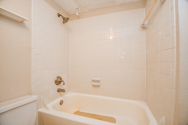 bathroom featuring toilet and shower / washtub combination