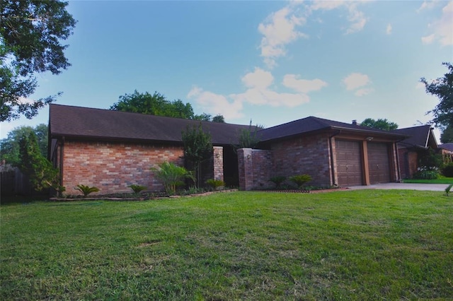 ranch-style home with a front lawn and a garage