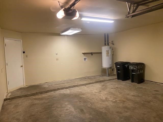 garage featuring a garage door opener and water heater