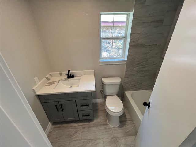 bathroom featuring tile patterned flooring, toilet, and vanity