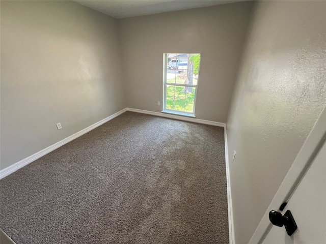 unfurnished room featuring carpet