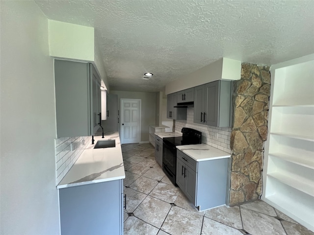 kitchen featuring tasteful backsplash, sink, gray cabinetry, light tile patterned floors, and black range with electric cooktop