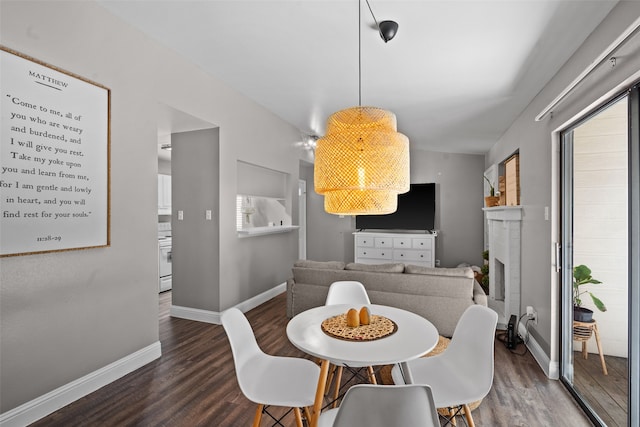 dining space featuring wood-type flooring