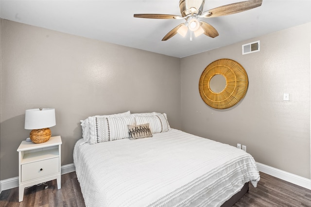 bedroom featuring ceiling fan and dark wood-type flooring