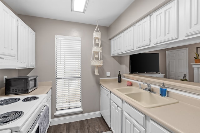 kitchen with white cabinetry, sink, dark hardwood / wood-style flooring, white dishwasher, and stove