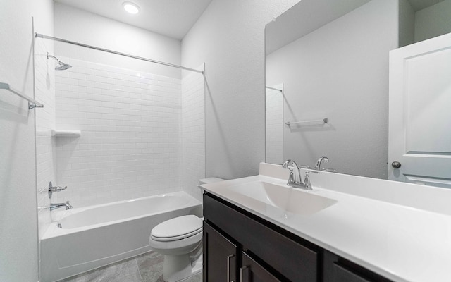 full bathroom featuring vanity, toilet, and tiled shower / bath combo