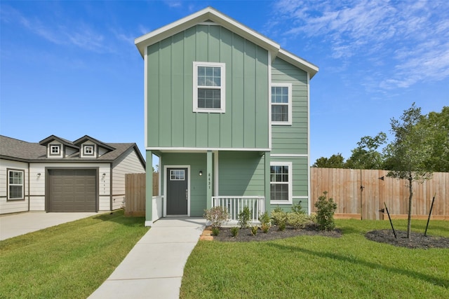 view of front facade featuring covered porch, a garage, and a front yard