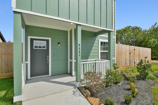 entrance to property with covered porch