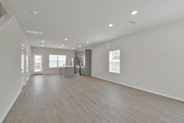 unfurnished living room featuring light hardwood / wood-style flooring