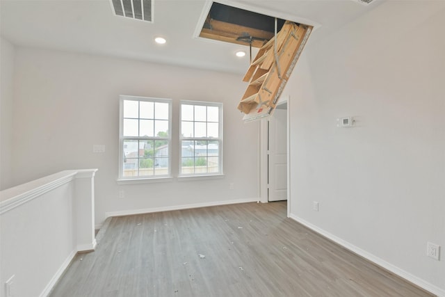 unfurnished room featuring light wood-type flooring