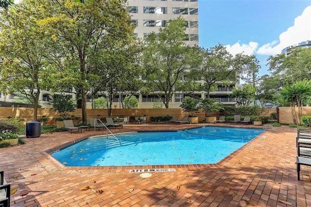 view of pool featuring a patio area