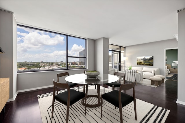 dining area featuring dark hardwood / wood-style floors