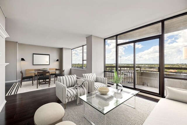 living room featuring hardwood / wood-style flooring and floor to ceiling windows