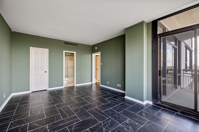 spare room featuring tile patterned flooring