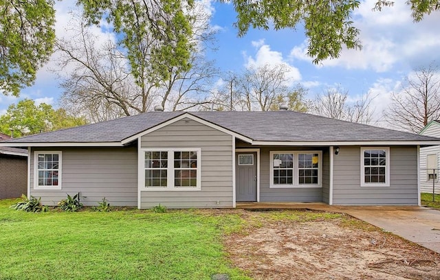 ranch-style home with a front lawn