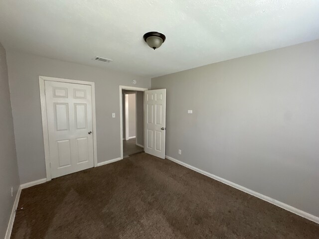 unfurnished bedroom featuring carpet