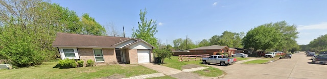 single story home with a front lawn and a garage