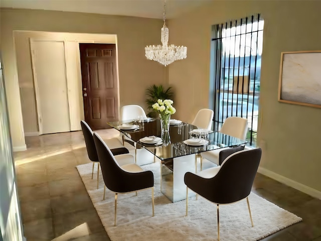 dining room featuring a healthy amount of sunlight and an inviting chandelier