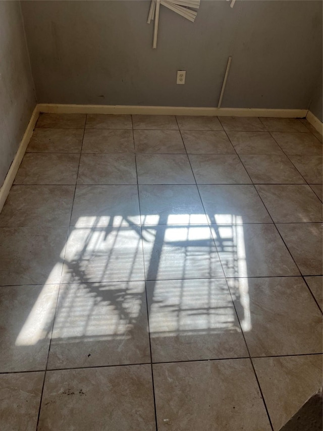 empty room with light tile patterned flooring