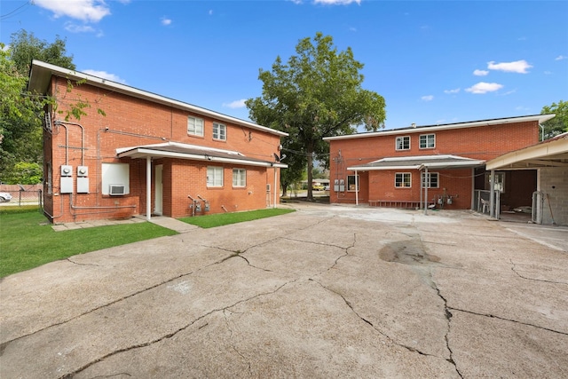 rear view of property featuring a carport