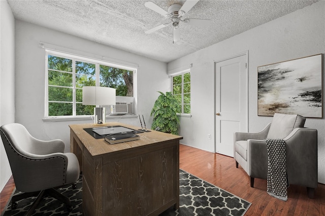 office area with ceiling fan, a textured ceiling, and wood-type flooring