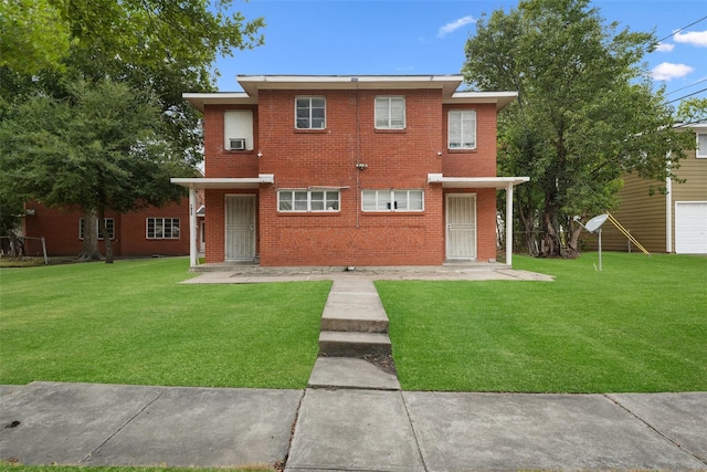 view of front of property featuring a garage and a front yard