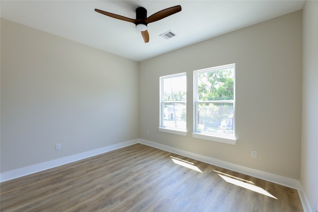 spare room with ceiling fan and light hardwood / wood-style flooring