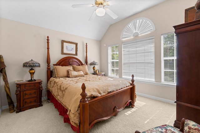 bedroom with vaulted ceiling, baseboards, a ceiling fan, and light colored carpet