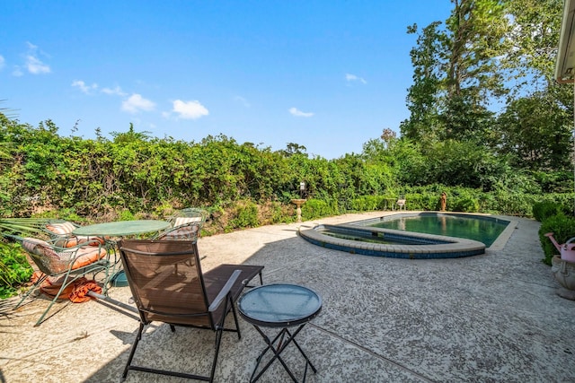 view of patio / terrace featuring an outdoor pool