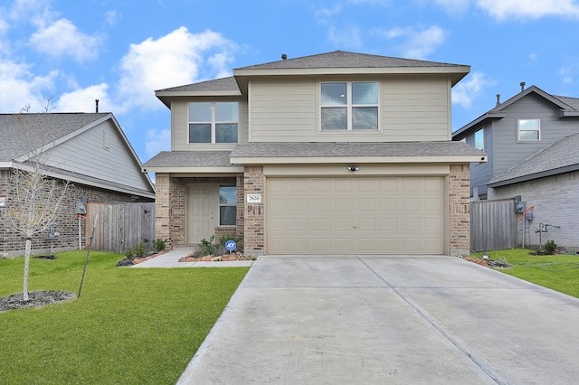 view of front property with a garage and a front lawn