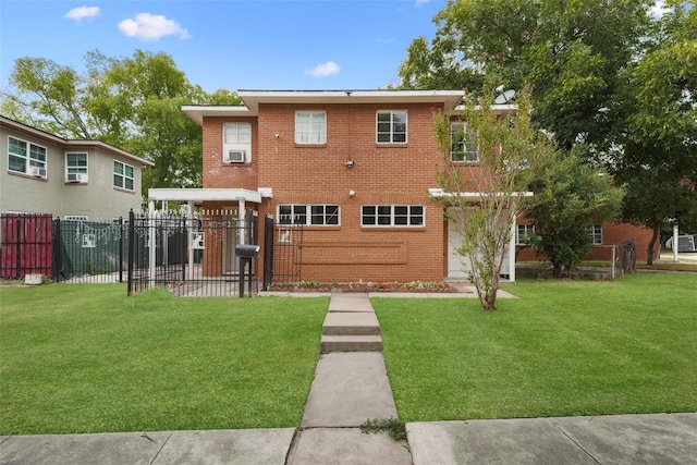 rear view of property with a yard