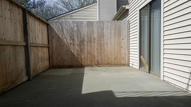 view of patio / terrace featuring fence