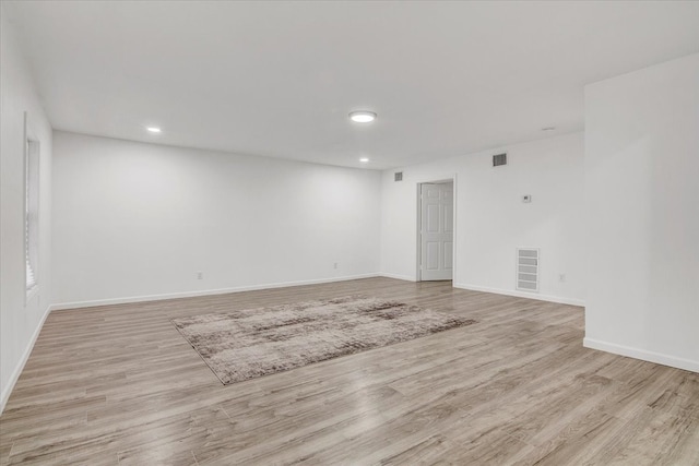 unfurnished room with light hardwood / wood-style flooring