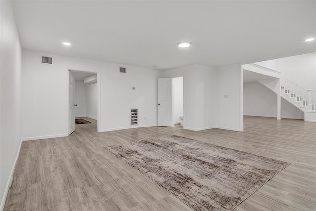 unfurnished living room with light hardwood / wood-style floors