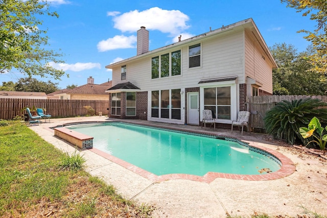 view of swimming pool featuring a fenced backyard, a fenced in pool, and a patio