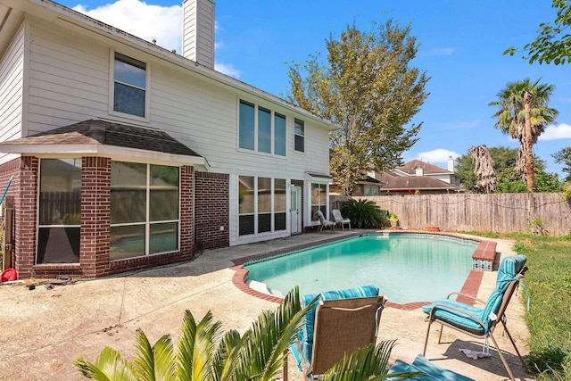 view of pool featuring a fenced in pool, a patio area, and fence