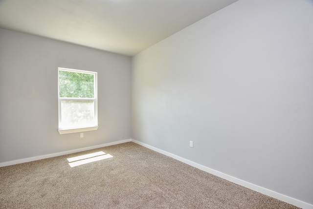 unfurnished room featuring carpet floors