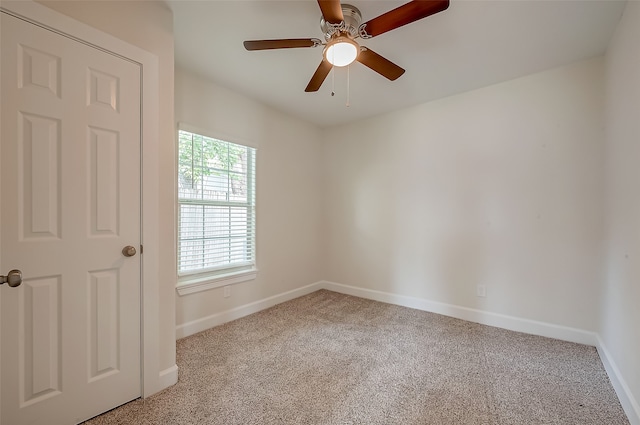 unfurnished room with ceiling fan and light colored carpet