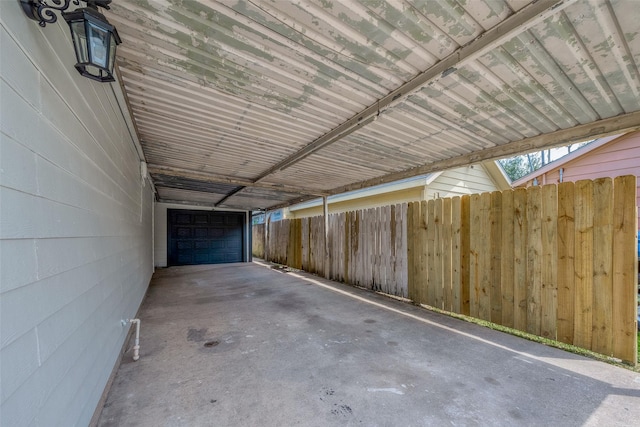 garage with fence