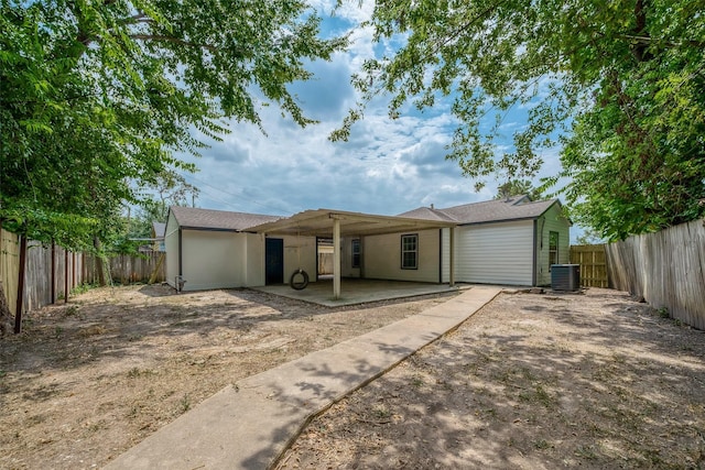 view of front of property with cooling unit, a fenced backyard, and a patio area