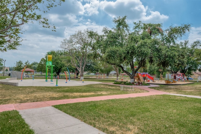 view of home's community featuring a yard and a playground