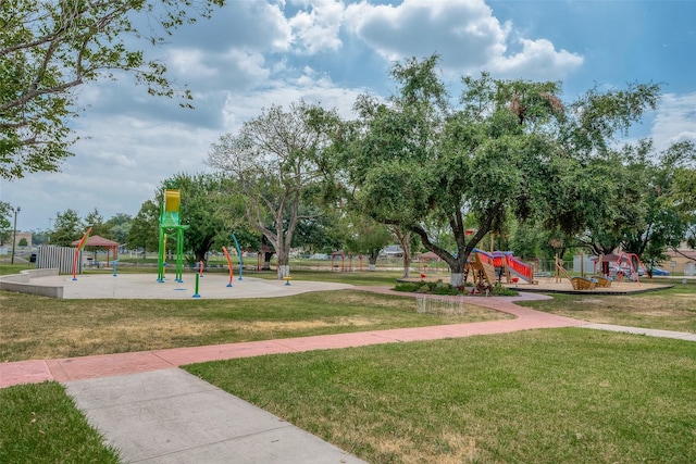 surrounding community with playground community and a yard