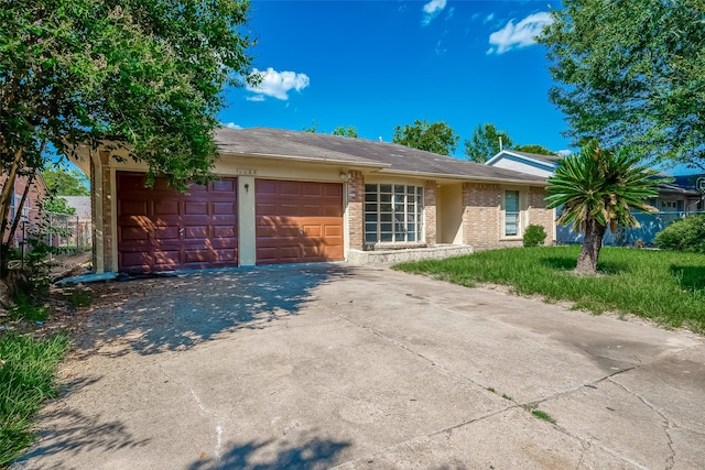 ranch-style house featuring a garage