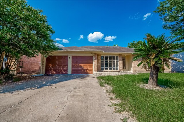 single story home with a garage