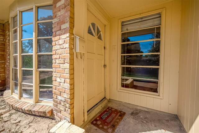 property entrance with stone siding