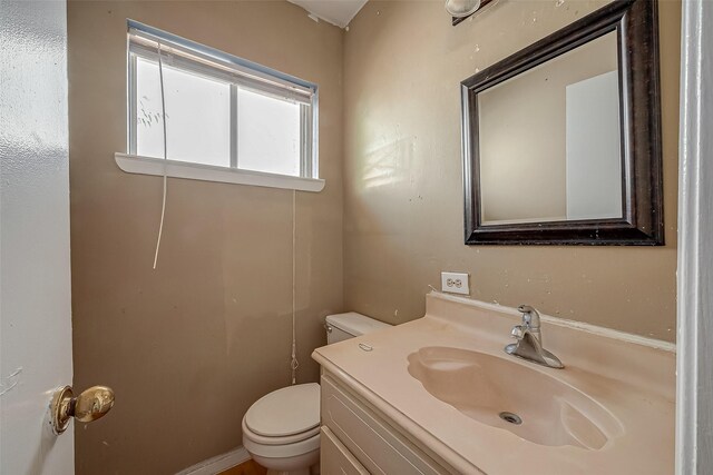 half bath with toilet and vanity