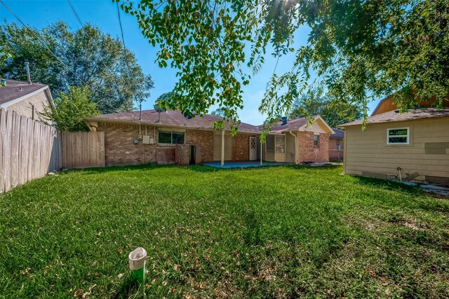 view of yard with a patio area and fence