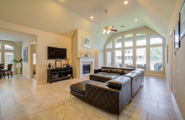 tiled living room with high vaulted ceiling and ceiling fan