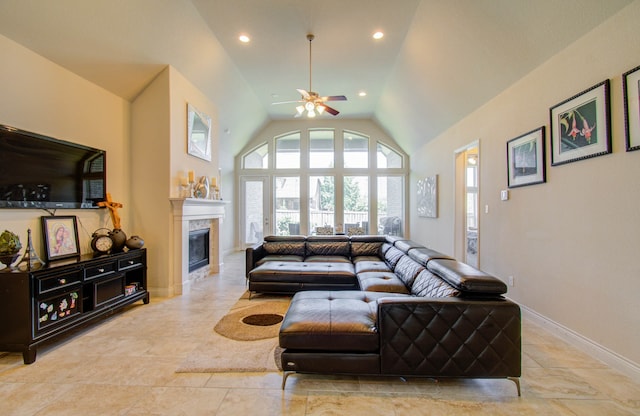 tiled living room with ceiling fan and high vaulted ceiling