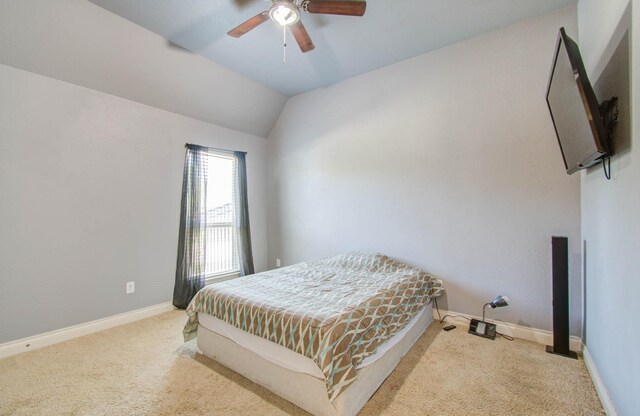 carpeted bedroom featuring ceiling fan and lofted ceiling